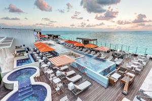 a view of the pool on the deck of a cruise ship at Royalton CHIC Cancun, An Autograph Collection All-Inclusive Resort - Adults Only in Cancún