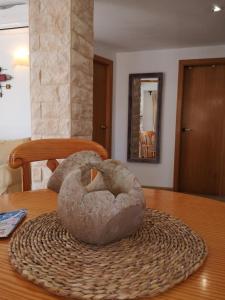 a stone sculpture sitting on top of a table at Apartamento Santa in Alicante