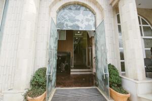 an entrance to a building with an open door at Hotel Flowers in Međugorje