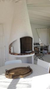 a table with a wooden tray on top of a table at Casa Blanca in Altea