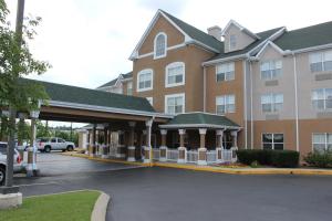 a large building with a parking lot in front of it at Country Inn & Suites by Radisson, Nashville, TN in Nashville