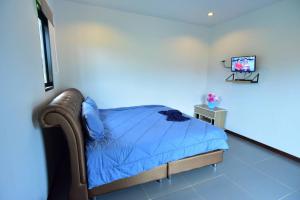Postel nebo postele na pokoji v ubytování Music Khao Kho