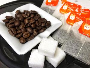 a plate of food with coffee beans on a table at QuiikCat in Kuching