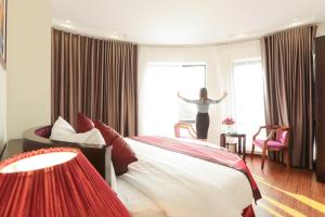 Postel nebo postele na pokoji v ubytování A&D Luxury Hotel