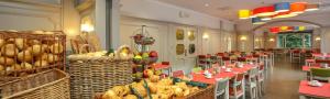 a dining room with tables and chairs and baskets of food at Floreal La Roche-en-Ardenne in La-Roche-en-Ardenne +67 photos