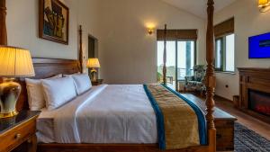 Postel nebo postele na pokoji v ubytování Larisa Resort, Mussoorie