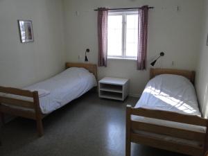 Postel nebo postele na pokoji v ubytování Sunne Hembygdsgård B&B