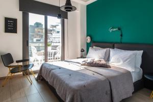 Posteľ alebo postele v izbe v ubytovaní 14 Reasons Why Hotel Psirri
