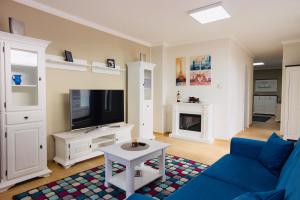 Et tv og/eller underholdning på Lira Holiday Apartments