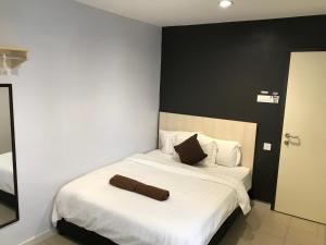 Hotel Seri Kangsar KK Hotel客房内的一张或多张床位