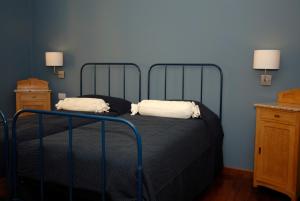 En eller flere senge i et værelse på B&B Residenza Cavour