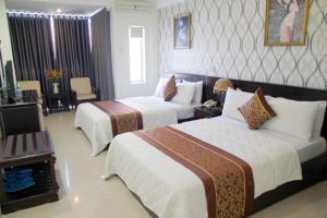 Cama o camas de una habitación en Khanh Duy Hotel