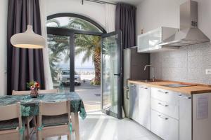 Kuchyň nebo kuchyňský kout v ubytování Apartman Visnja + 29 fotografií