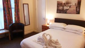 Postel nebo postele na pokoji v ubytování Medehamstede Hotel