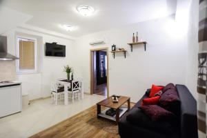 Televízia a/alebo spoločenská miestnosť v ubytovaní Grand Bedroom Aptm Palace Top Location