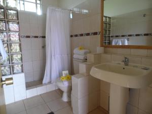 Baðherbergi á Hotel Manutara