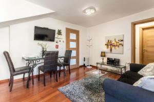 a living room with a couch and a table at Apartments and Rooms Villa Erede in Split