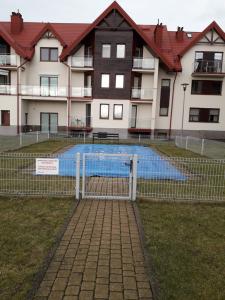 Bazén v ubytovaní APARTAMENT Piątka alebo v jeho blízkosti