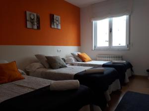 A bed or beds in a room at Ultreia