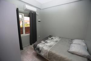 Postel nebo postele na pokoji v ubytování Donfarsha Apartments