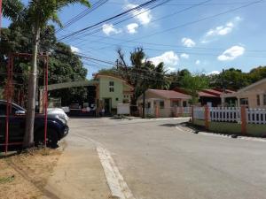 a street with a car parked in front of a house at Laly's B8 cozy Vacation Townhouse in Olongapo +38 photos
