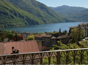 a view of a lake in a town with mountains at CASA VISTA LAGO E GIARDINO in Porlezza