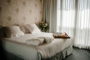 Uma cama ou camas num quarto em Ellauri Hotel Landscape SPA - Adults Only