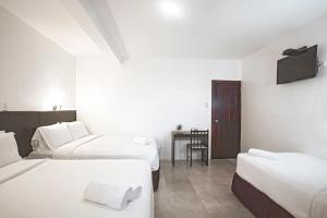 Postel nebo postele na pokoji v ubytování Hotel La Ría Playas