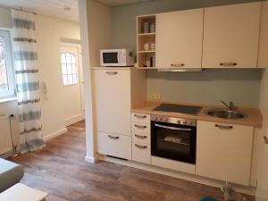 Kuchyň nebo kuchyňský kout v ubytování Gästehaus Becker