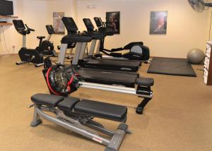 a gym with several exercise bikes in a room at Pheasant Park Resort in Sister Bay