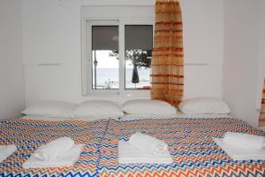 Postel nebo postele na pokoji v ubytování Marina Beach House