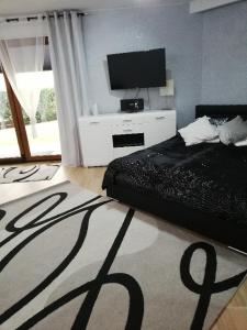 En eller flere senge i et værelse på Apartament Superior Maloves Władysławowo