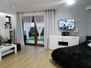 Et tv og/eller underholdning på Apartament Superior Maloves Władysławowo