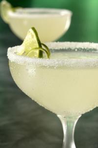 a margarita with a lime in a martini glass at Solyar Luxury Spanish Beachfront Home in Pochomil