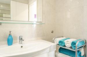 a bathroom with a sink and a mirror and towels at KORČULA Antea Apartment in Prizba +41 photos