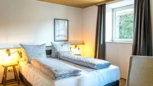 Postel nebo postele na pokoji v ubytování Das Nordberg Guesthouse