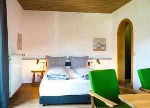 Кровать или кровати в номере Das Nordberg Guesthouse