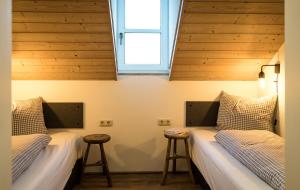 Postel nebo postele na pokoji v ubytování Das Nordberg Guesthouse