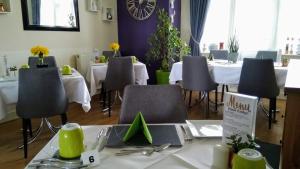 a dining room with tables and chairs in a restaurant at Ebor Lodge in Eastbourne
