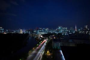 a view of a city at night with a river at Hotel Grand Arc Hanzomon in Tokyo +37 photos