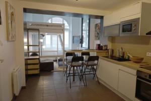 Η κουζίνα ή μικρή κουζίνα στο Cosy Appartement proche Gares #1 +5 φωτογραφίες