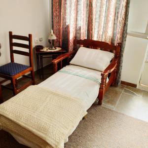En eller flere senger på et rom på Sunny Home II