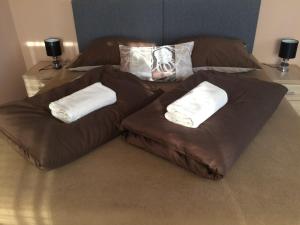 A bed or beds in a room at Apartmány u Galandu