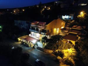 an aerial view of a house at night at Apartments & Rooms KARLA in Dramalj