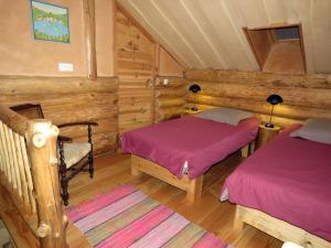 Postel nebo postele na pokoji v ubytování La cabane de Hans