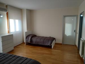 En eller flere senger på et rom på Appartamento Casa Lina