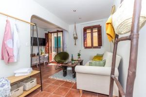 a room with a loft bed and a living room at Mediterrani Studio - The Old Town in Tarragona