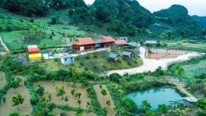 an aerial view of a house on a hill at Eco House Mộc Châu in Mộc Châu