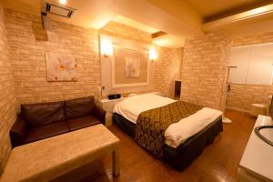 Voodi või voodid majutusasutuse Hotel Allure (Adult Only) toas
