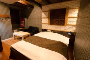 Voodi või voodid majutusasutuse Hotel Allure (Adult Only) toas